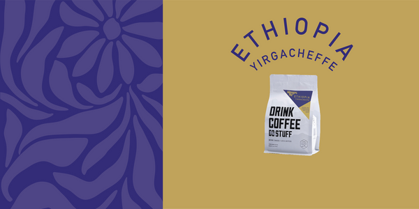 Image shows purple floral motif, with a yellow box and a white DCDS coffee bag juxtaposed on top with 