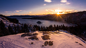 A view of Lake Tahoe from the top of a snowy mountain