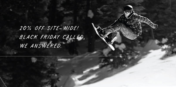 Black and white photo of a snowboarder, with text that reads 