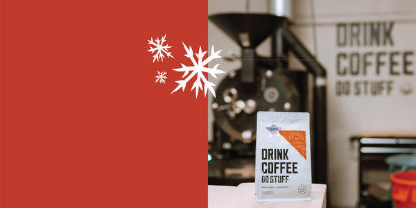 Coffee packaging with a red background and coffee grinder in the background