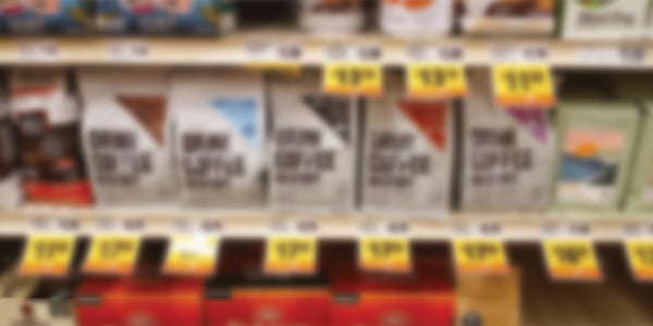 Blurred shelves with automotive products and price tags in a store setting