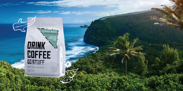 Pano image of Hawaii landscape with Aloha Baby coffee bag juxtaposed in the foreground.